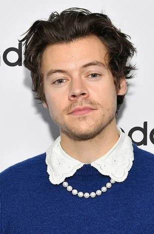 Harry Styles wearing pearl necklaces