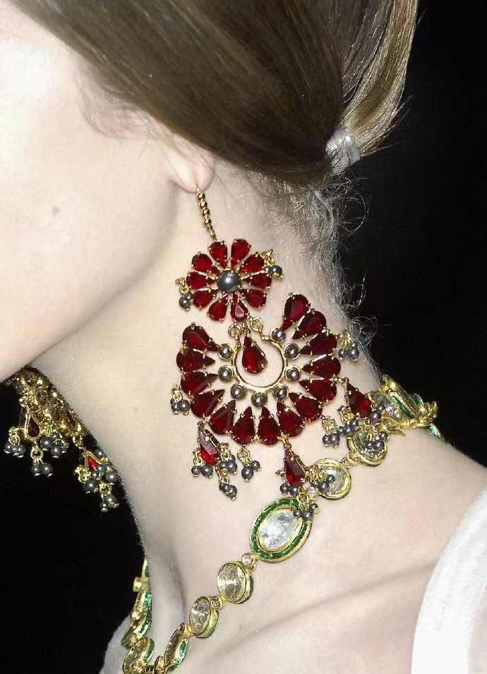 Alexander McQueen 2008 Fall/Winter red fan-shaped earrings feature a mix of vintage glamour and Gothic style.