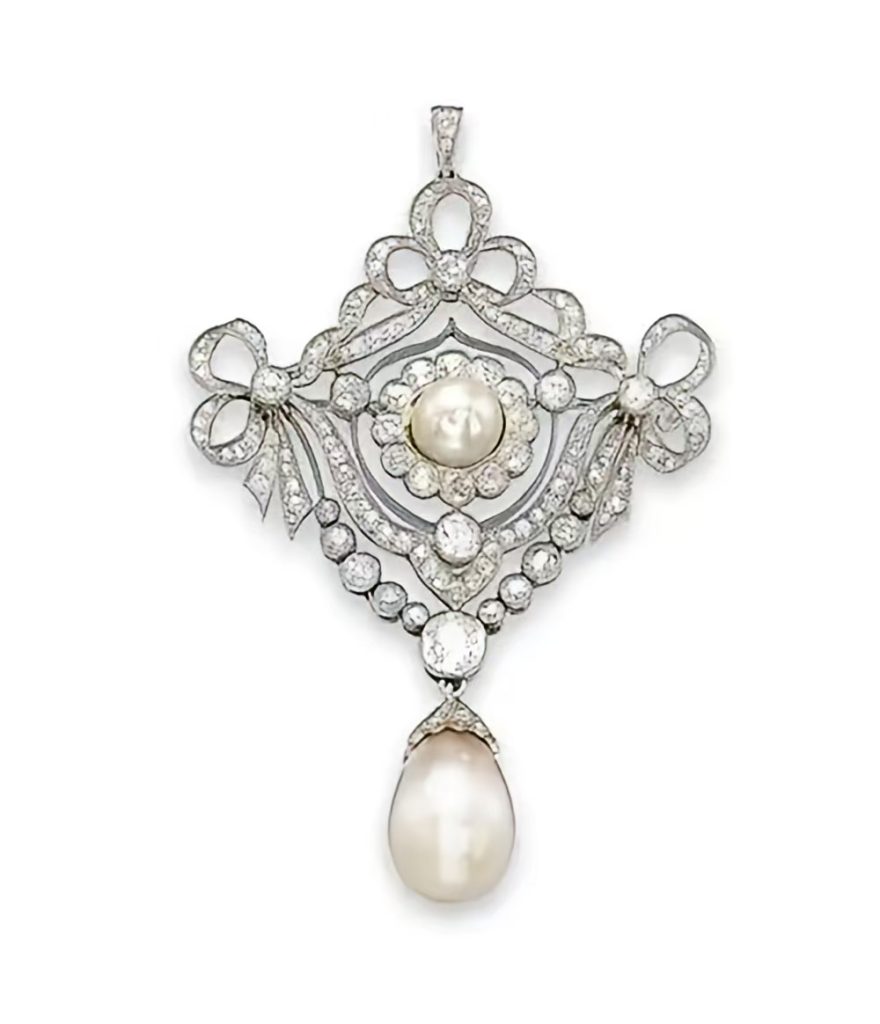 Edwardian lace jewelry, showing truly exquisite layers of intricate filigree platinum work inspired by lace.