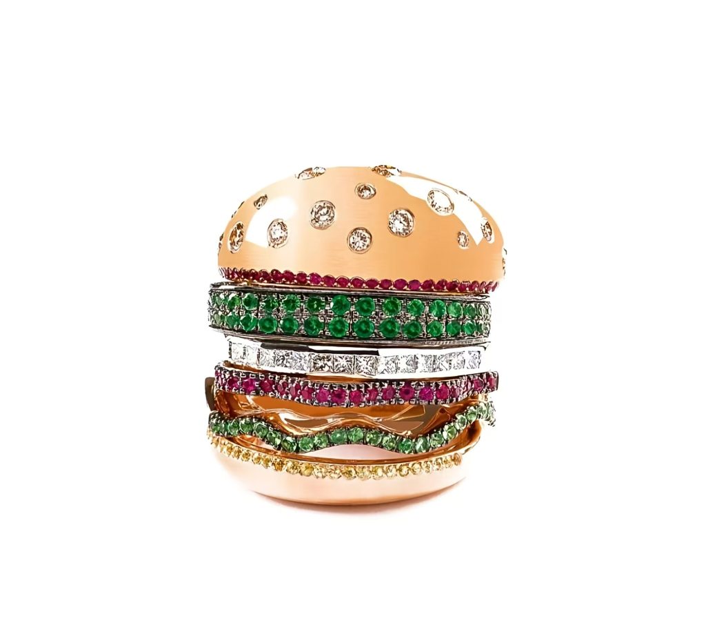 A burger-inspired stackable ring in 18K gold and diamonds by Nadine Ghosn.